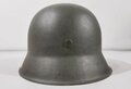 Heer, Stahlhelm Modell 1942. Überlackiert, der Innenfutterring und die Nieten Original, der Rest, ebenso wie die Abzeichen neuzeitlich unrichtig ergänzt