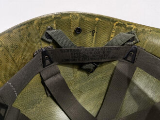 U.S. Army Liner parachutists helmet, dated 1983. Including a sweatband and cotton chinstrap. Unused