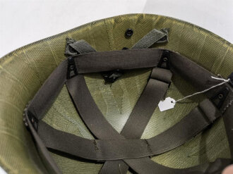 U.S. Army Liner parachutists helmet, dated 1983. Including a sweatband and cotton chinstrap. Unused