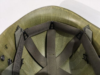 U.S. Army Liner parachutists helmet, dated 1983. Including a sweatband and cotton chinstrap. Unused