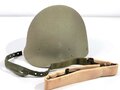 U.S. Army Liner parachutists helmet, dated 1983. Including a sweatband and cotton chinstrap. Unused