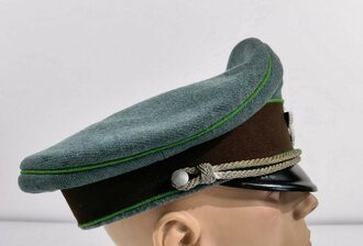 Polizei III.Reich, Schirmmütze für einen Unteroffizier der Schutzpolizei. Kopfgrösse 57 ( gemessen ) Im Deckel flecken und ein Loch, sonst guter Zustand
