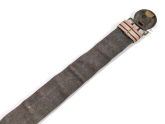 1.Weltkrieg Württemberg, Feldbinde für einen Offizier, Messingschloss getönt, Feldgrau hinterlegt, die Nähte zum Teil offen. Gesamtlänge 95cm