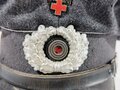 Deutsches Rotes Kreuz, Schirmmütze für Mannschaften, der Lederschirm angetrocknet, diverse Mottenschäden