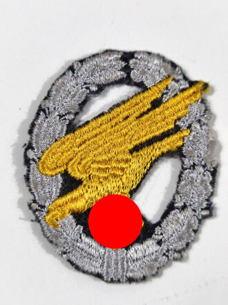 Urkundengruppe eines Fallschirmjägers mit Fallschirmschützenabzeichen in Stoffausführung und Erkennungsmarke, Angehöriger 1./Fallschirm M.G. Bataillon