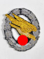 Urkundengruppe eines Fallschirmjägers mit Fallschirmschützenabzeichen in Stoffausführung und Erkennungsmarke, Angehöriger 1./Fallschirm M.G. Bataillon