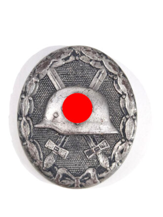 Verwundetenabzeichen in Schwarz, Magnetisch, Rückseitig mit Hersteller " 93 für Richard Simm & Söhne, Gablonz "getragenes Stück