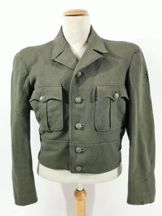 Waffen SS ?, Feldbluse für einen Offizier Modell 1944. Eigentumstück , das Innenfutter im Fischgrätmuster. Getragenes Stück, diverse kleinere Reparaturen, Mottenschäden. Kein Effektensitz erkennbar