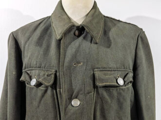 Heer, Feldbluse Modell 1944 aus italienischem Tuch. Stark...