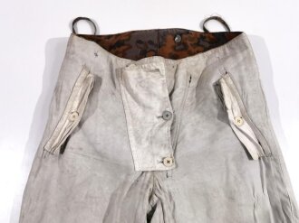 Waffen SS Wintertarnhose. Getragenes Stück mit diversen defekten. Farbfrisch