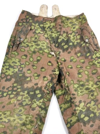 Waffen SS Wintertarnhose,. stark getragenes Stück mit vielen reparaturstellen, diese zum Teil auch neuzeitlich