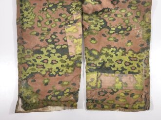 Waffen SS Wintertarnhose,. stark getragenes Stück mit vielen reparaturstellen, diese zum Teil auch neuzeitlich