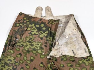 Waffen SS Wintertarnhose,. stark getragenes Stück mit vielen reparaturstellen, diese zum Teil auch neuzeitlich