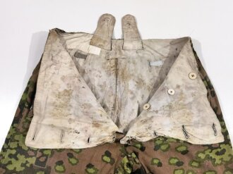 Waffen SS Wintertarnhose,. stark getragenes Stück mit vielen reparaturstellen, diese zum Teil auch neuzeitlich