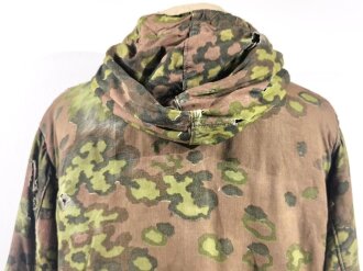 Waffen SS Winterwendejacke. Getragenes Stück mit vielen, zum Teil auch neuzeitlichen Reparaturstellen.