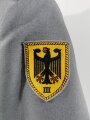 Bundeswehr, Dienstrock für einen Artilleristen, original vernähte Ärmelbänder " Heeresunteroffizierschule III"  guter Zustand, datiert 1973