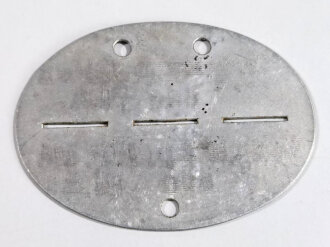 Erkennungsmarke Wehrmacht aus Aluminium eines Angehörigen " Verfg.komp.J.E.B.414 828 B1.A " Verpflegungskompanie Infanterie- Ersatz Battalion 414