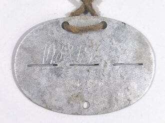 Erkennungsmarke Wehrmacht aus Aluminium eines Angehörigen " Inf.Ers.Bat.L 311 1. Kp " Infanterie Ersatz Batallion Leicht 311/ 1. Kompanie