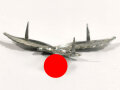 Luftwaffe, Adler für eine Schirmmütze, ungetragenes Stück, Eisenblech versilbert. Späte Fertigung mit mitgeprägten Splinten