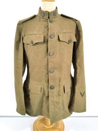 U.S. WWI Model 1917 tunic, member of the Engineer Corps Headquarter in the 8th Army. One overseas service chevron. British war department stamp inside tunic.