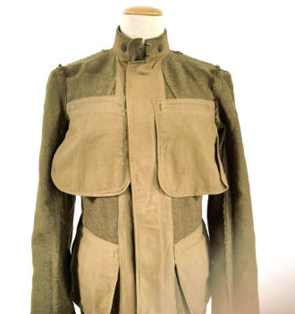 U.S. WWI Model 1917 tunic, member of the Engineer Corps Headquarter in the 8th Army. One overseas service chevron. British war department stamp inside tunic.