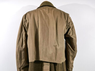 U.S. 1943 dated wool overcoat. Size 36R. Good condition, Most likely original sewn "Engineer amphibian unit" patch and four overseas service bars.