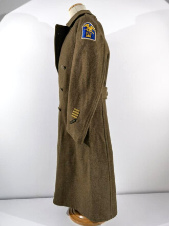 U.S. 1943 dated wool overcoat. Size 36R. Good condition, Most likely original sewn "Engineer amphibian unit" patch and four overseas service bars.