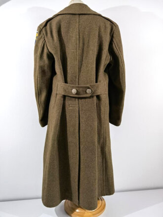 U.S. 1943 dated wool overcoat. Size 36R. Good condition, Most likely original sewn "Engineer amphibian unit" patch and four overseas service bars.