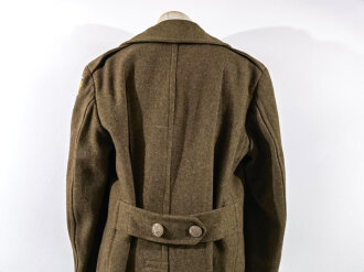 U.S. 1943 dated wool overcoat. Size 36R. Good condition, Most likely original sewn "Engineer amphibian unit" patch and four overseas service bars.