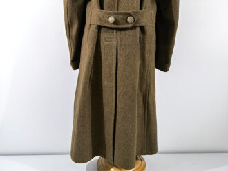 U.S. 1943 dated wool overcoat. Size 36R. Good condition, Most likely original sewn "Engineer amphibian unit" patch and four overseas service bars.