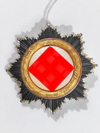 Deutsches Kreuz in gold. Hersteller "20" innen...