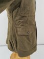 U.S. WWI AEF Model 1917 Tunic, member of an "Advanced Service of Supply" unit Two overseas stripes, good condition, label dated July 1918