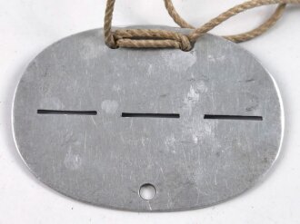 Erkennungsmarke Wehrmacht aus Aluminium eines Angehörigen " 1. Fsp.Ers.Kp.N.E.A.19 " 1. Fernsprech Ersatz. Kompanie. Nachrichten. Ersatz. Abteilung. 19