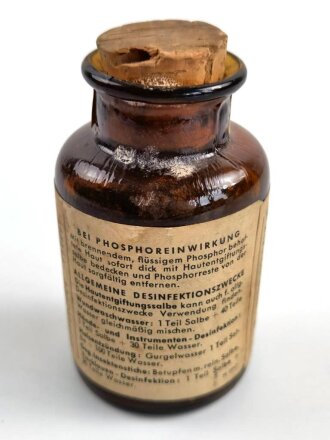 Glasflasche "Hautentgiftungssalbe" datiert 1944. Gesamthöhe 9,5cm. NUR FÜR DEKORATIONSZWECKE