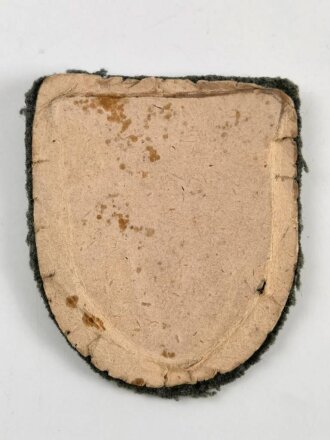 Kubanschild, Eisen bronziert, getragenes Stück