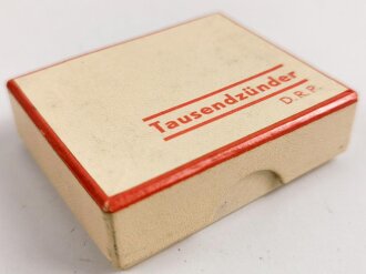 "Tausendzünder" Taschenfeuerzeug in Verpackung mit Anleitung, dise mit Druckvermerk von 1937, ungebraucht, Funktion nicht geprüft