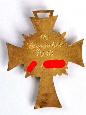 Ehrenkreuz der Deutschen Mutter ( Mutterkreuz ) in Gold, untere Emaille am Kreuz beschädigt