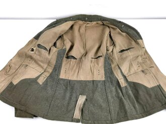 Feldbluse Modell 1940 für Mannschaften des Heeres. Kammerstück von 1941., stark getragen, Flickstellen. Ungereinigt