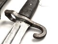 Österreich, Seitengewehr Modell 1870, ungereinigt, mit Koppelschuh, Herstellermarke auf Klingenansatz, Drückerfede bzw Drückerknopf entfernt und mit Zinn ausgefüllt,