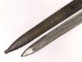 Österreich, Seitengewehr  Modell 1895 Mannlicher  für Stutzen, Eigentumstück,  Portepeeöse fehlt, Hersteller FGGY, Spitze der Klinge um ca 2 cm gekürz, Drücker fest
