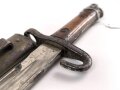 Österreich, Seitengewehr  Modell 1895 Mannlicher  für Stutzen, Eigentumstück,  Portepeeöse fehlt, Hersteller FGGY, Spitze der Klinge um ca 2 cm gekürz, Drücker fest