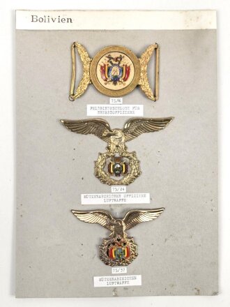 Bolivien, Sammlung Mützenabzeichen Luftwaffe und Feldbindenschloss für Heeresoffiziere