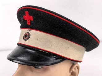 Württemberg, Schirmmütze für einen Angehörigen der freiwilligen Krankenpflege mit leichtem Mottenschaden