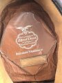 Schirmmütze für einen Angehörigen der Deutschen Reichsbahn. Ungereinigtes Stück, Kopfgrösse gemessen 56