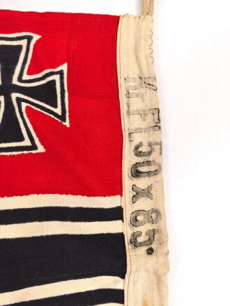 Kriegsmarine, Reichskriegsflagge in der kleinen Ausführung für U-Boote. Markiert " Kr. Fl. 50 x 85" sowie unleserlicher Herstellerstempel. Guter Zustand