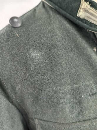 Feldbluse Modell 1935 für Mannschaften des Heeres. Stark getragenes Kammerstück, selten