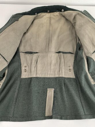 Feldbluse Modell 1935 für Mannschaften des Heeres. Stark getragenes Kammerstück, selten