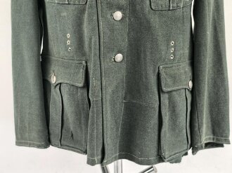 Feldbluse Modell 1935 für Mannschaften des Heeres. Stark getragenes Kammerstück, selten