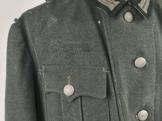 Feldbluse Modell 1935 für Mannschaften des Heeres. Stark getragenes Kammerstück, selten