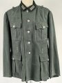 Feldbluse Modell 1935 für Mannschaften des Heeres. Stark getragenes Kammerstück, selten